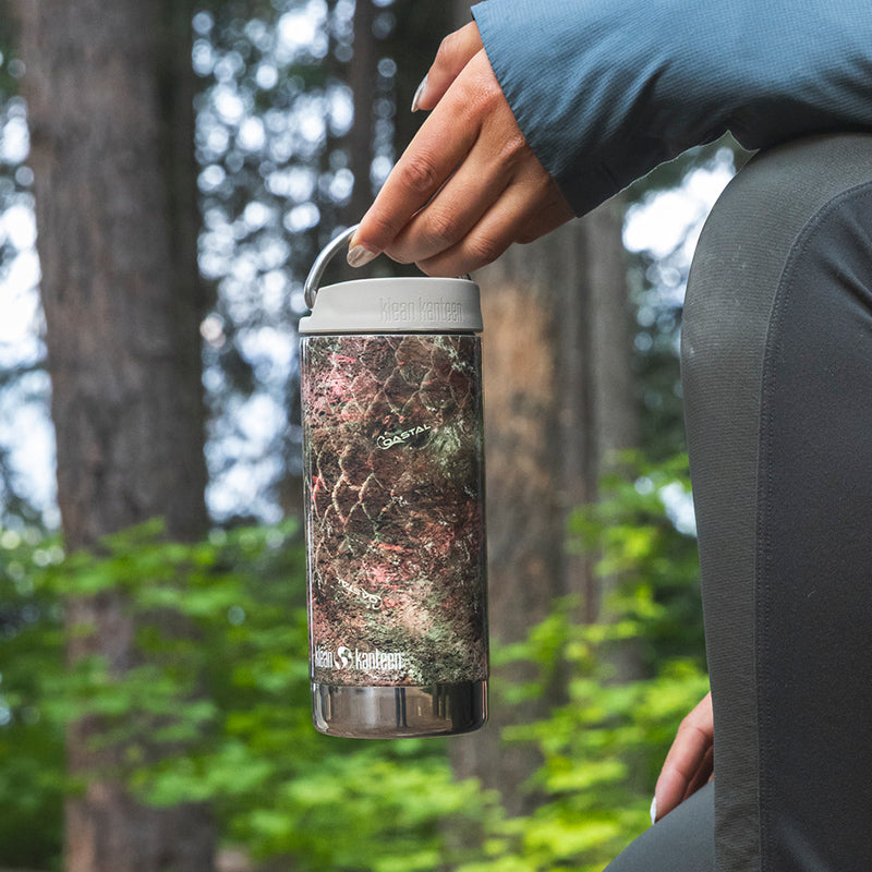 12oz-tkwide-with-twist-cap-mossy-oak-o5 12oz_tumbler_mossyoak_rainbowtrout_hand_closeup_square.jpg