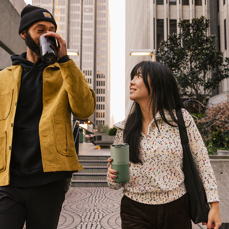 16oz-rise-tumbler-u3 16oz_rise_tumbler_black_iceberg_couple_drink_city_street_square.jpg