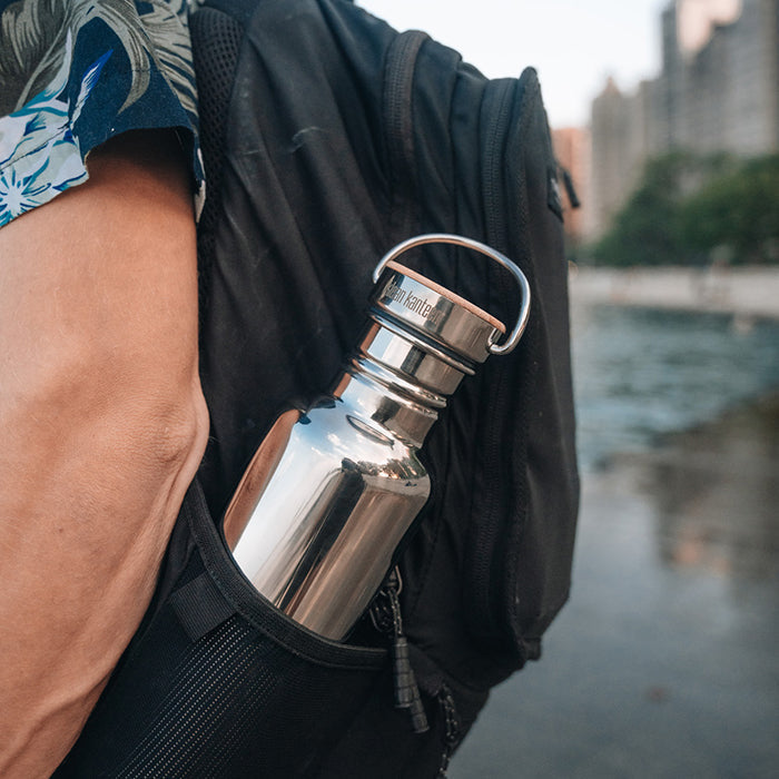 27oz-reflect-with-bamboo-cap-g1 K27SSLRF-MS-BAMBOO_reflect-bottle_backpack_lifestyle.jpg
